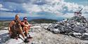 couple sitting on top of Bletoppen
