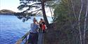 Lady takes picture of 2 boys on a trip on the coastal path from Brevik to Skjelsvik