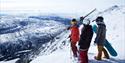 people with skis on top of Gaustatoppen