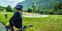Cyclist looking at one of many sculptures along Sogevegen.