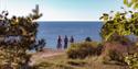 group of cyclists looking out over the garden on the Telemark coast