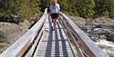 girl walking across a bridge at Mjonøy