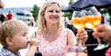 mother and child enjoy themselves on the terrace at Straand Hotel in Vrådal