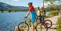 cyclists stand by the water in Vrådal