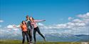 boy and 2 girls balancing on a rock