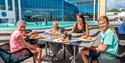 family eats on the terrace by the bathing park at Quality Hotel Skjærgården