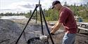 man grilling fish on barbecue