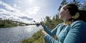 girl throwing fishing rod