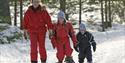 mother with children on snowshoes