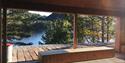 picnic area with a view of the water by the walking and cycling path "Kragerøbanen" in Drangedal