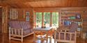 living room with sitting area in front of large window at Sandvanns cabin