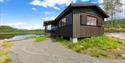 outside of the cabin by the lake