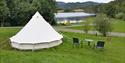 Glamping tent with a view of the water at Lystang Glamping