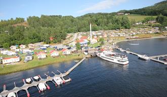 gjestebrygge på Norsjø Ferieland med plass til fritidsbåter  og anløp til MS Telemarken