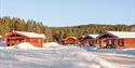 the cabins at First Camp Bø in winter