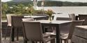terrace with table and chairs and views of the water at Quality Hotel Skjærdården in Langesund