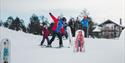 family on the children's slope at Vrådal Panorama ski centre