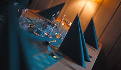 set table at restaurant at Austbø Hotel