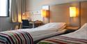 2 separate beds in one of the rooms at Bø Hotell