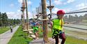 children climb the easiest trail in the climbing park - Skien fritidspark