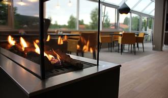 gas fireplace in the restaurant at Bø Hotell