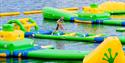 boy runs over obstacles at Hulfjell water park in Drangedal