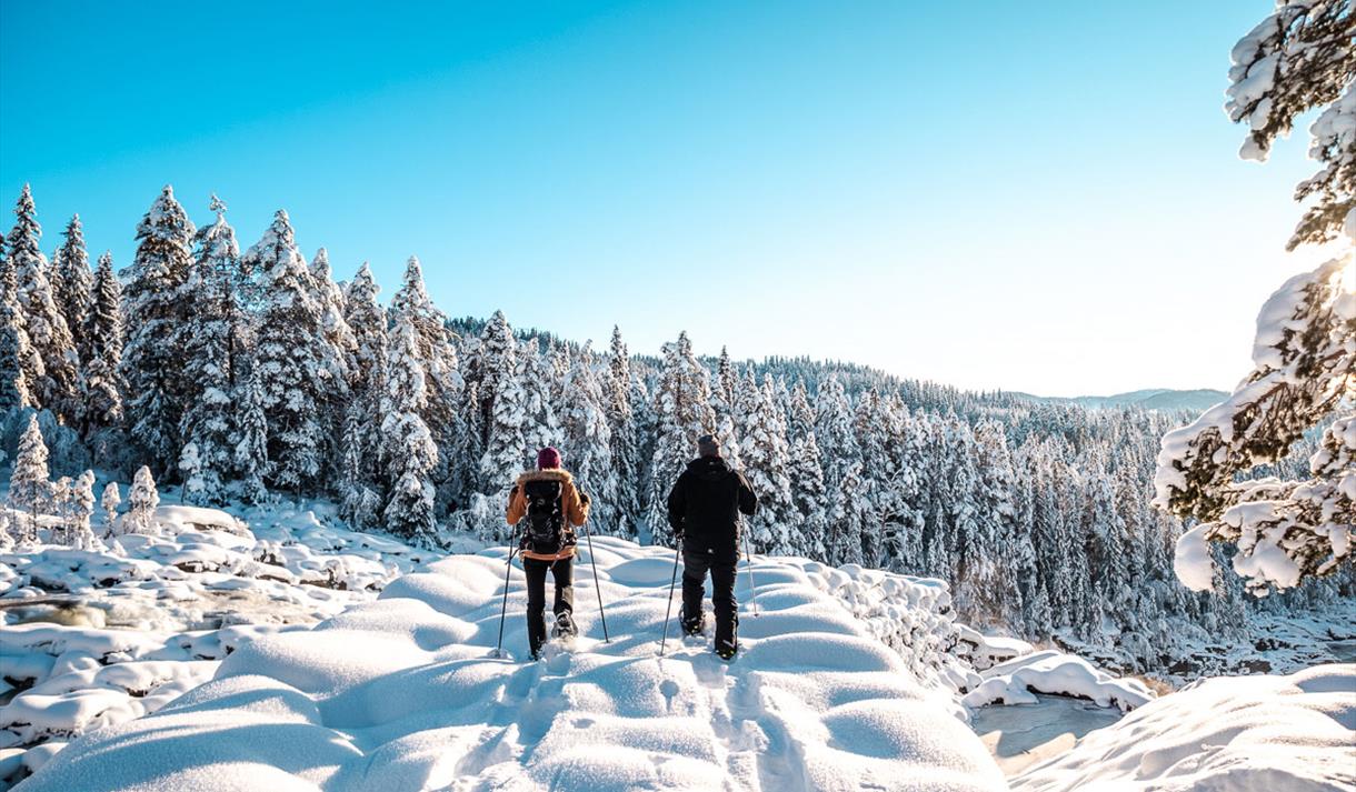 man and woman on a snowshoe trip