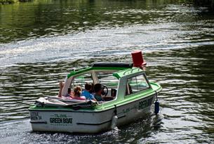 People in motor boat on the river thames