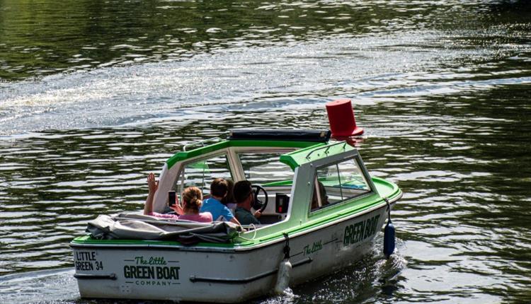 People in motor boat on the river thames