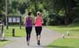 women jogging along the towpath at Runnymede