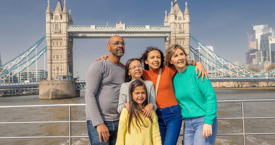 Family onboard City Cruises with Tower Bridge in background