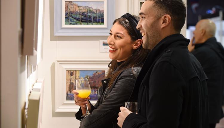 Visitors appreciating the art at Contemporary Art Fairs Windsor