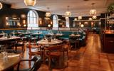 A restaurant venue with circle lights hanging from the ceiling.