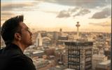 Gino looking out of the Sky Bar towards the city.