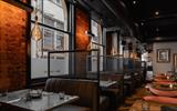A booth seating area with lights.