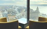 Two yellow seats are placed to look out over the city from the 34th floor, where the restaurant is situated.