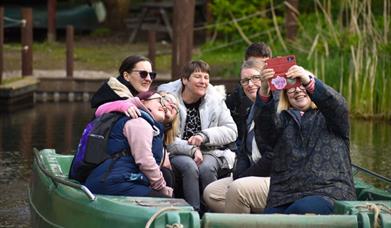 people on a boat at WWT Martin Mere Wetland Centre