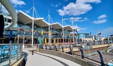 Gunwharf Quays Shopping Centre with a background of blue sky