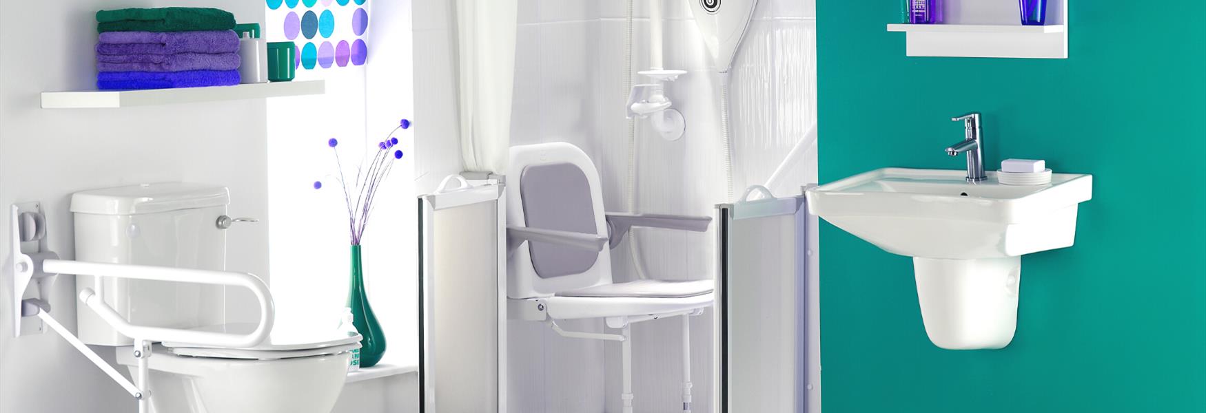 An accessible bathroom showing shower, toilet and sink