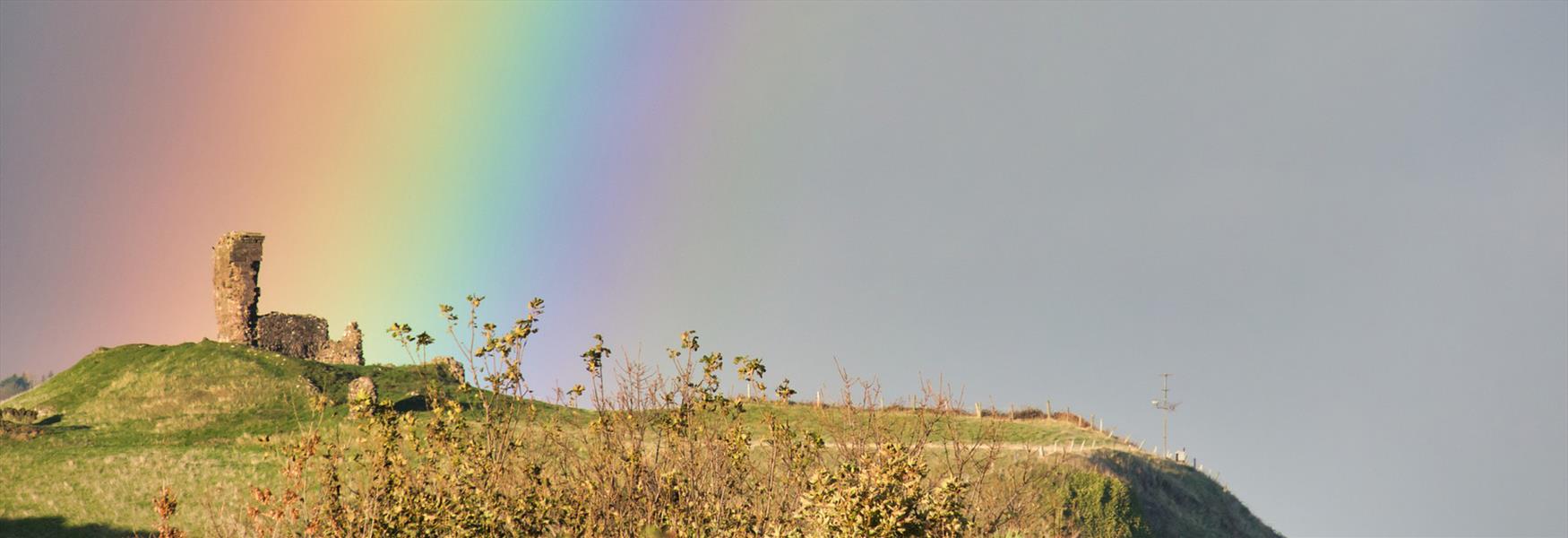 northern ireland coast rainbow ruins