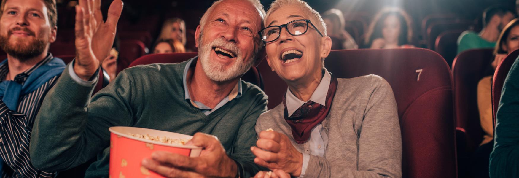 Elderly couple of man and woman at the theatre