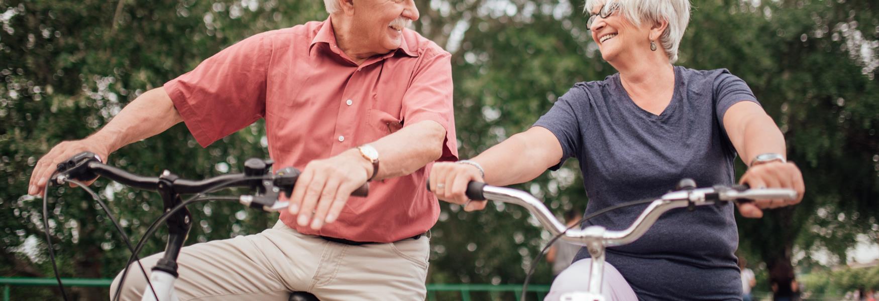 Elderly couple on bikes