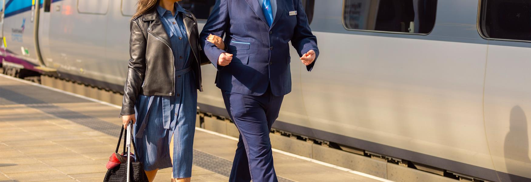 Staff at TransPenine helping a blind customer access the train