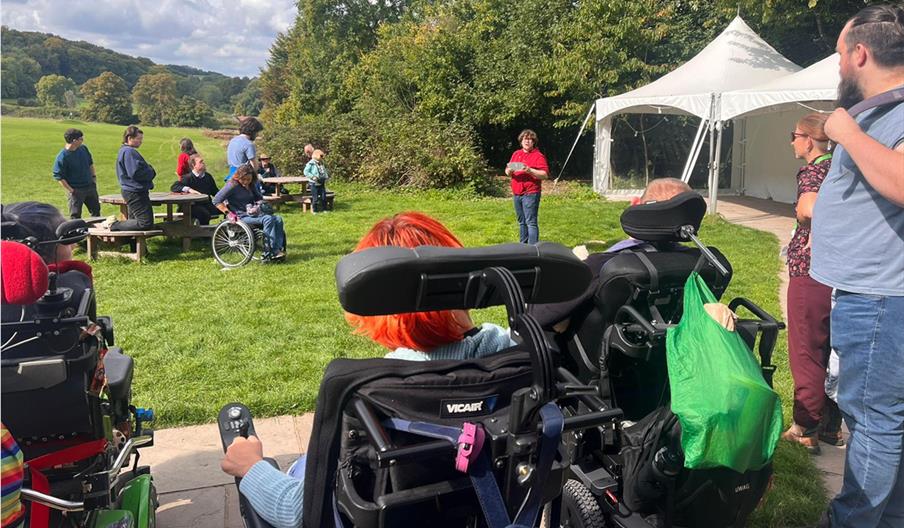 People in wheelchairs enjoying the view at Gilbert White's House