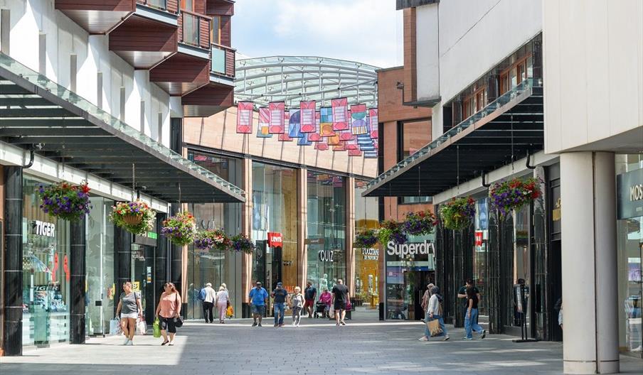 Shoppers walking through the Princesshay Shopping Centre