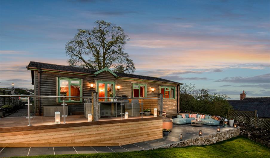 Hoe Grange Holiday's accessible lodges in the evening with the ramp lit up