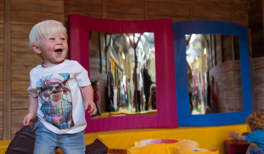 Small boy playing at Farmer Palmer's