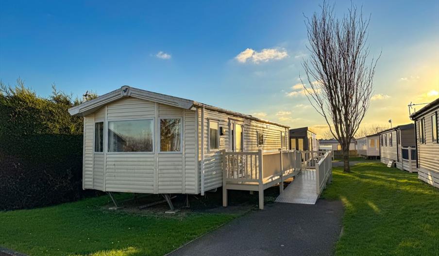 Adapted caravan with wheelchair ramp in the sunshine at Beverley Holidays