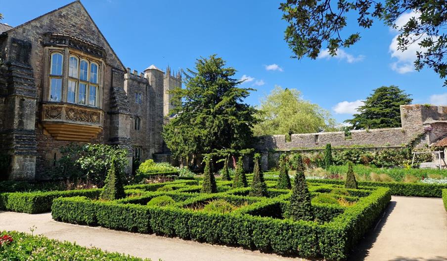 The gardens and outside of the Bishop’s Palace on a sunny day