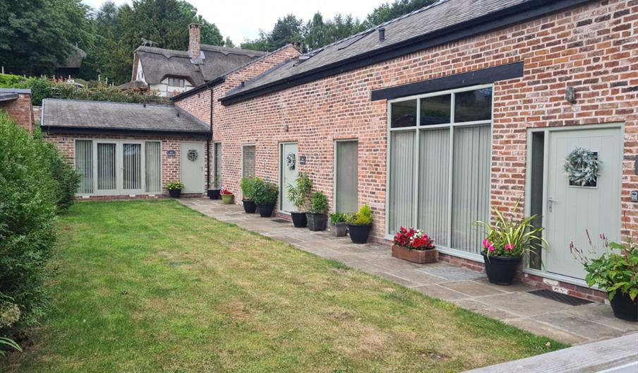 Garden and front door to Sandhole Cottages